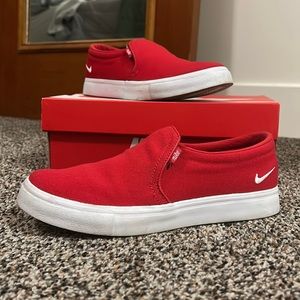 Red Nike Court Royale slip on shoes.